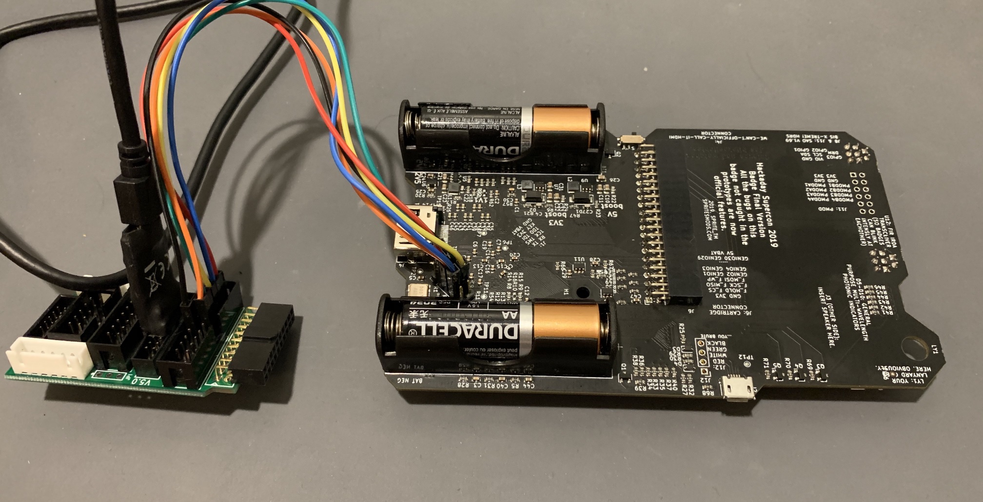 Digilent HS3 JTAG adapter connected to the Supercon badge