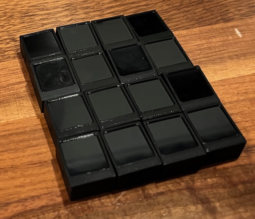 16 LCD key caps assembled with the LCDs inside and snapped together