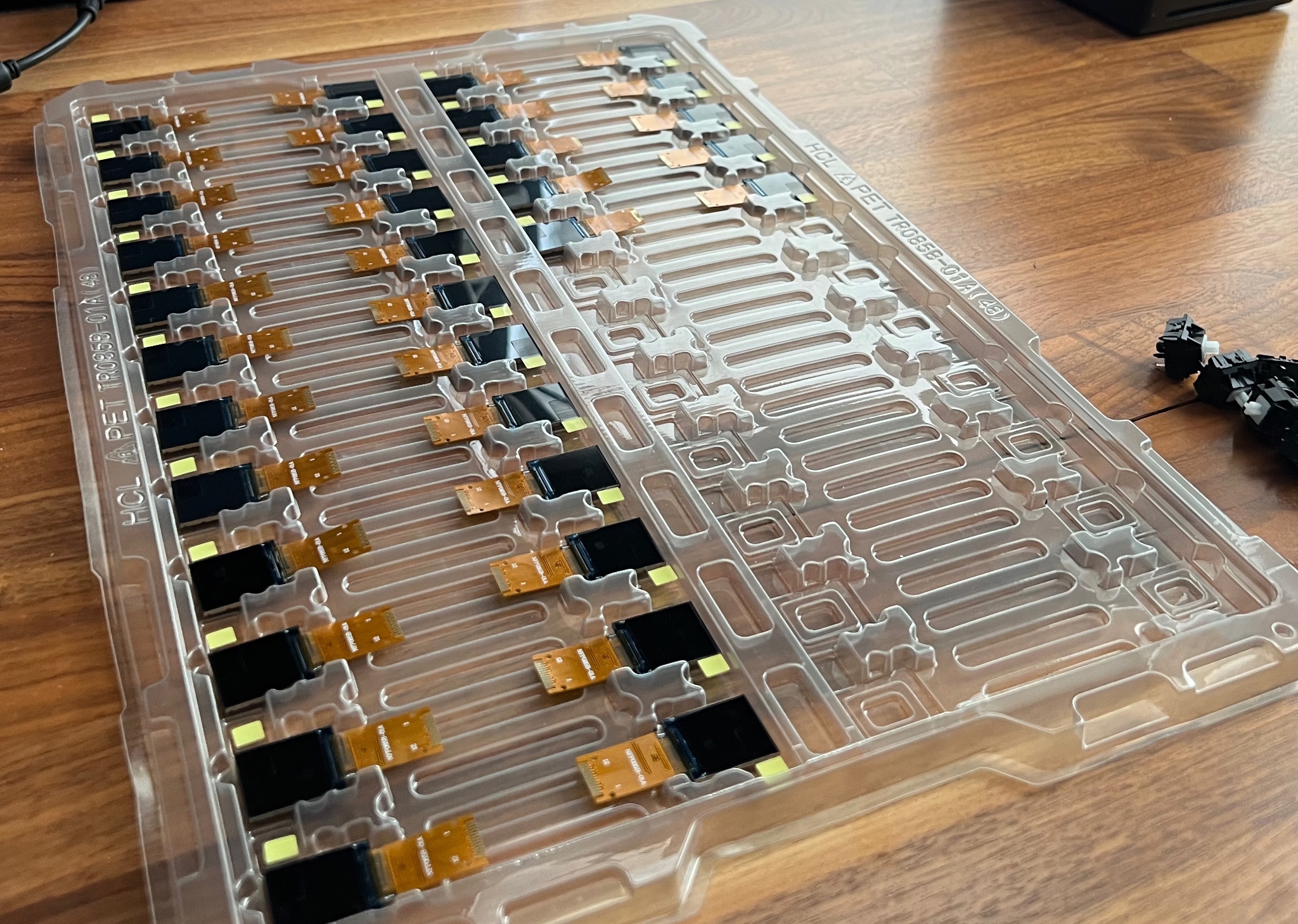 Plastic tray with cavities formed to hold each LCD in alternating orientation