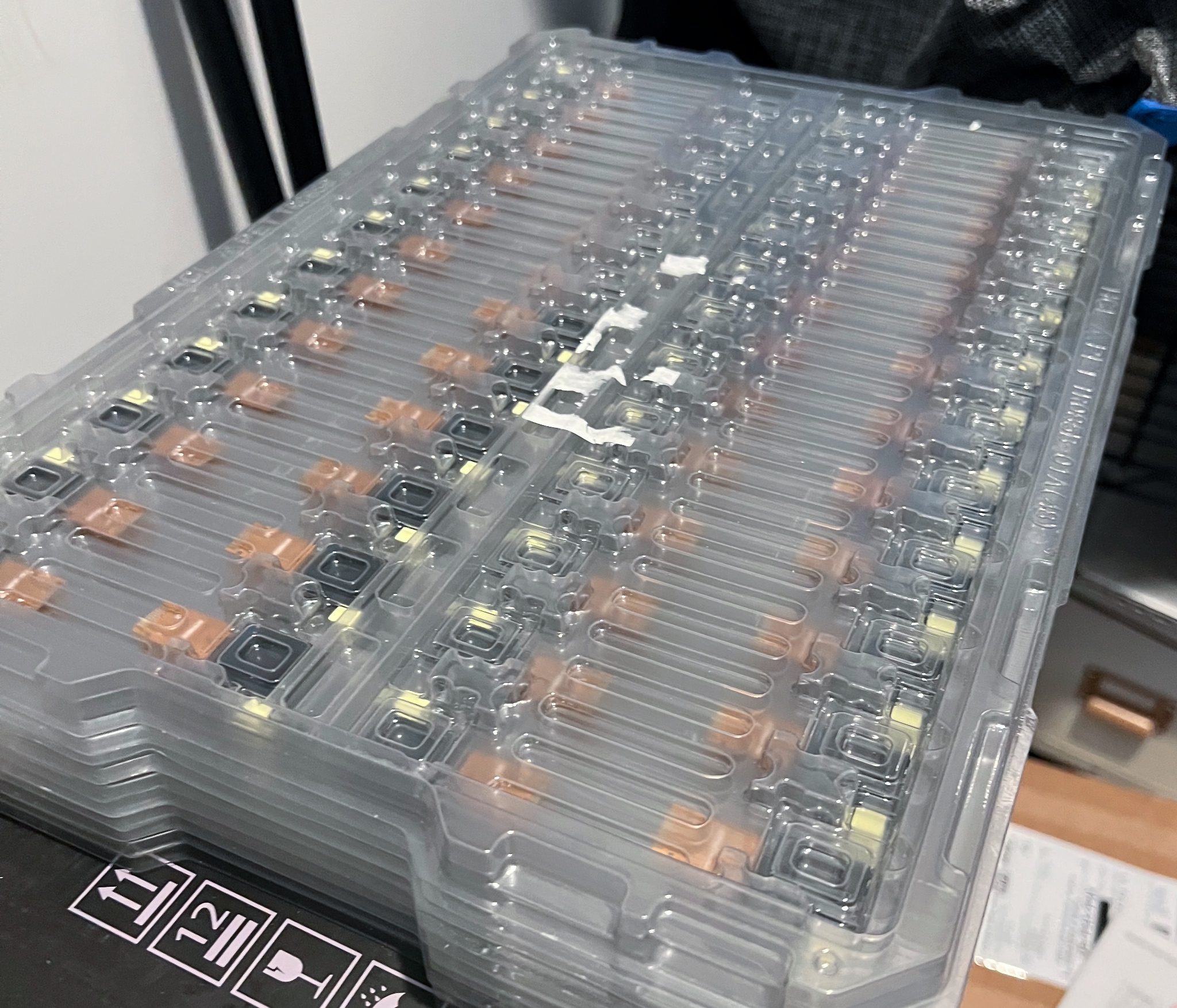 Stack of at least 9 trays of LCDs